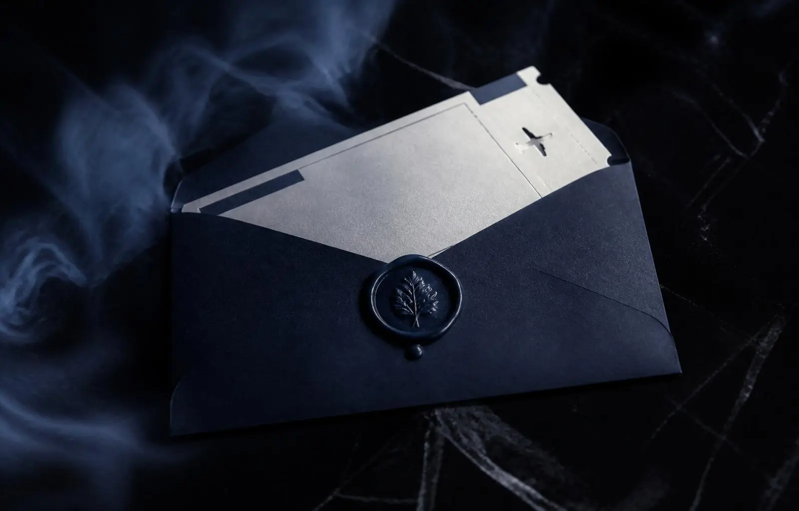 A sealed leather envelope on a walnut desk beside a brass compass — a secret destination.